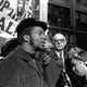 At a rally outside the U.S. Courthouse October 29, 1969, Dr. Benjamin Spock, background, listens to Fred Hampton, chairman of the Illinois Black Panther party. It was part of a protest against the trial of eight persons accused of conspiracy to cause a riot during the Democratic National Convention in 1968.